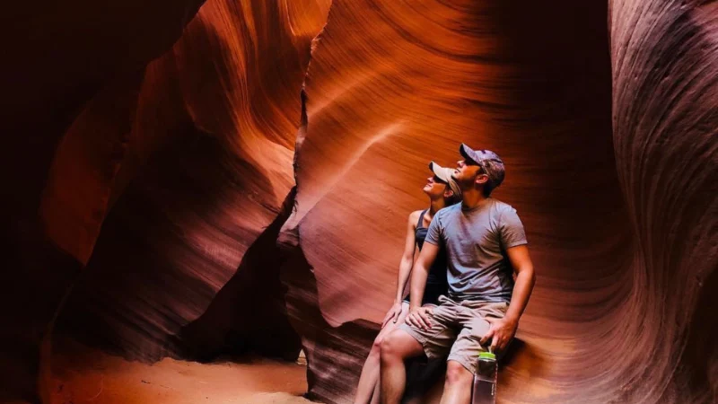 Couple in Lower Antelope couple sitting and posing for a photograph in lower antelope canyon