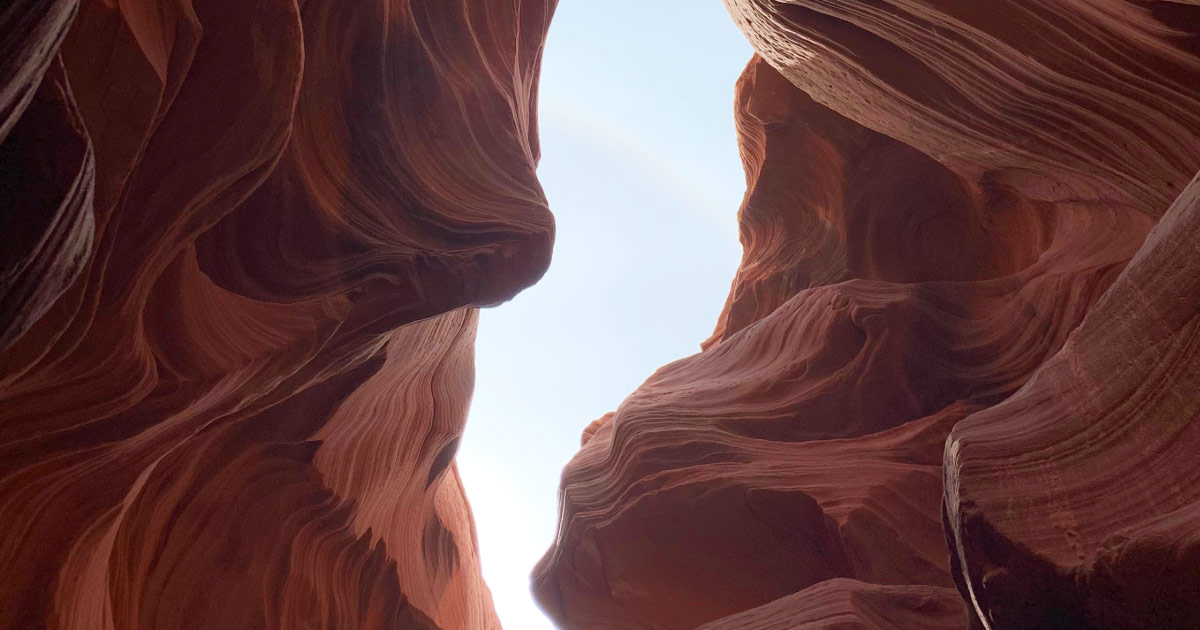 Photo taken looking up from Lower Antelope Canyon showing break in walls
